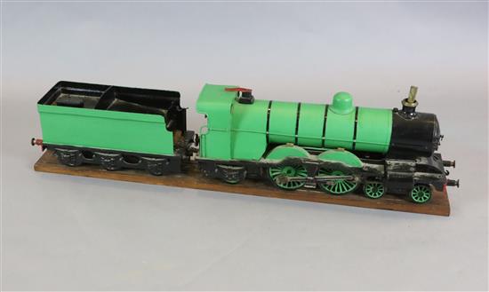 A 3.5 inch gauge 4-4-2 live steam locomotive and tender on wood stand, loco 27in. tender 18in.